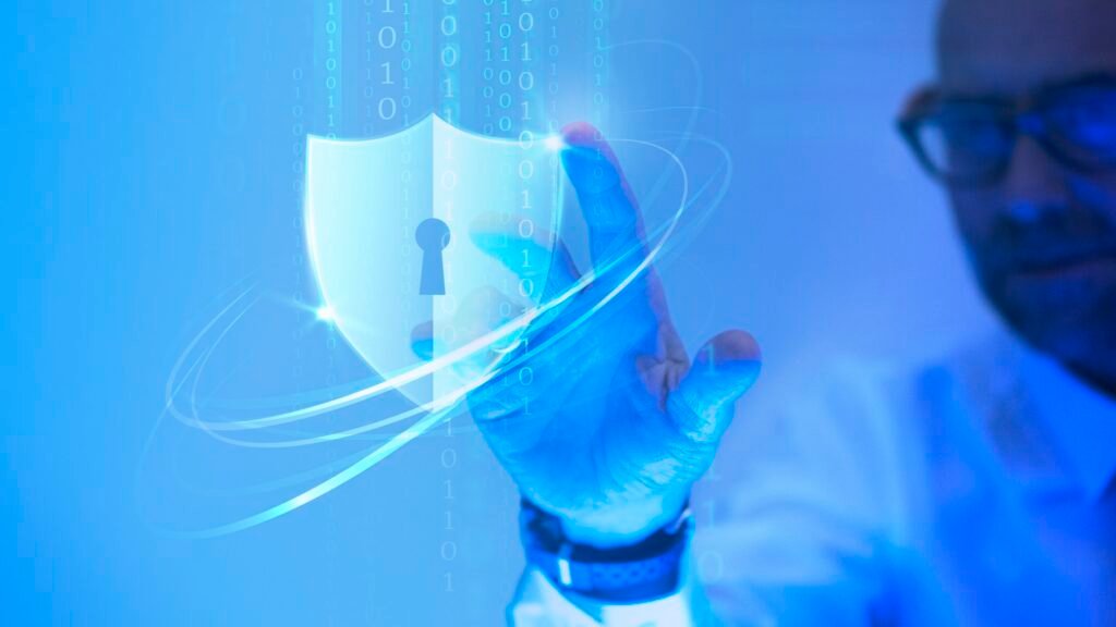 man touching a padlock shield icon